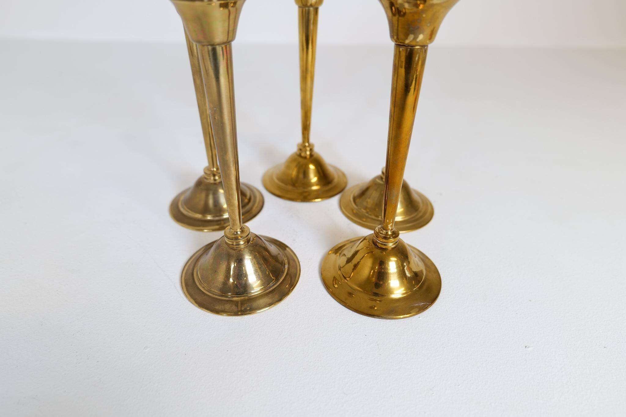 Mid-century set of 5 brass candlesticks by Lars Holmström, Arvika, Sweden.