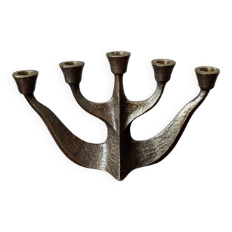 Vintage bronze candlestick chandelier in contemporary Scandinavian design.