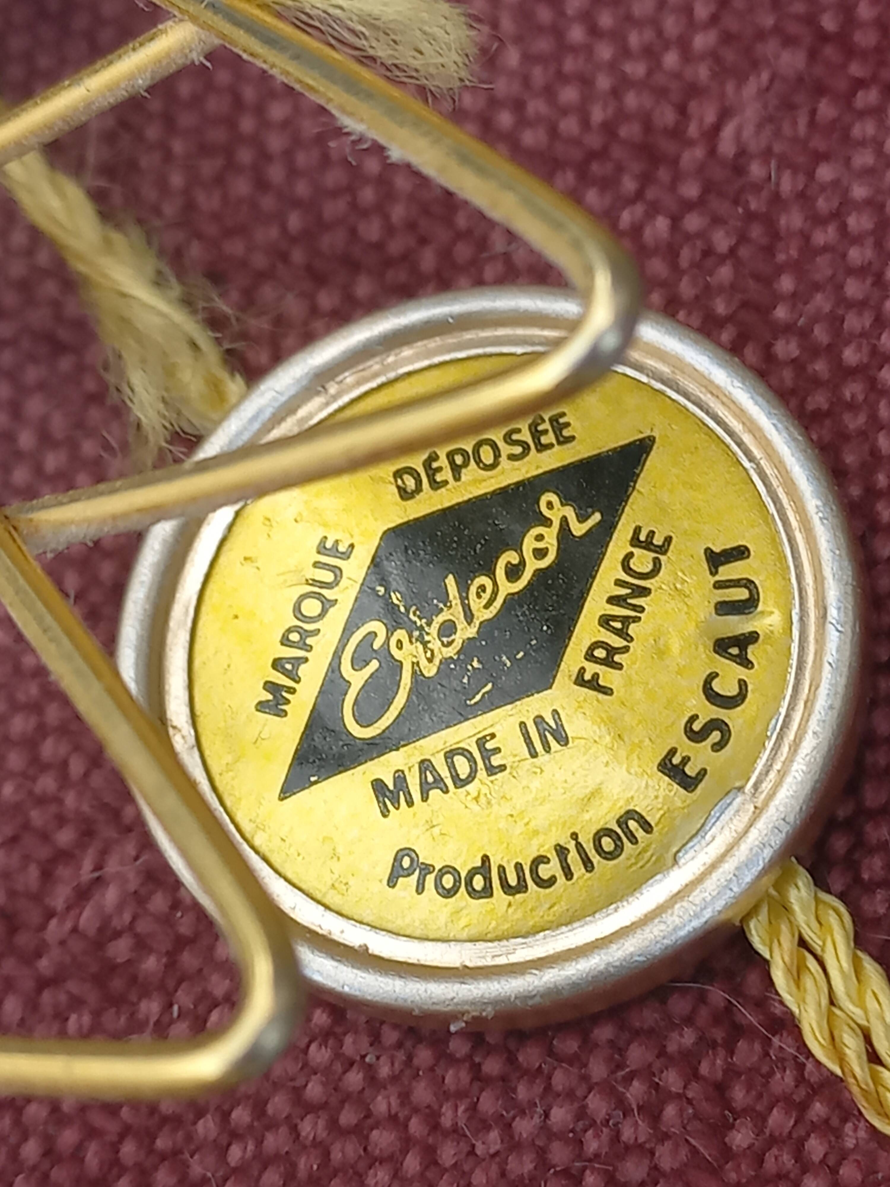 Vintage 1950s sun mirror in gold metal.