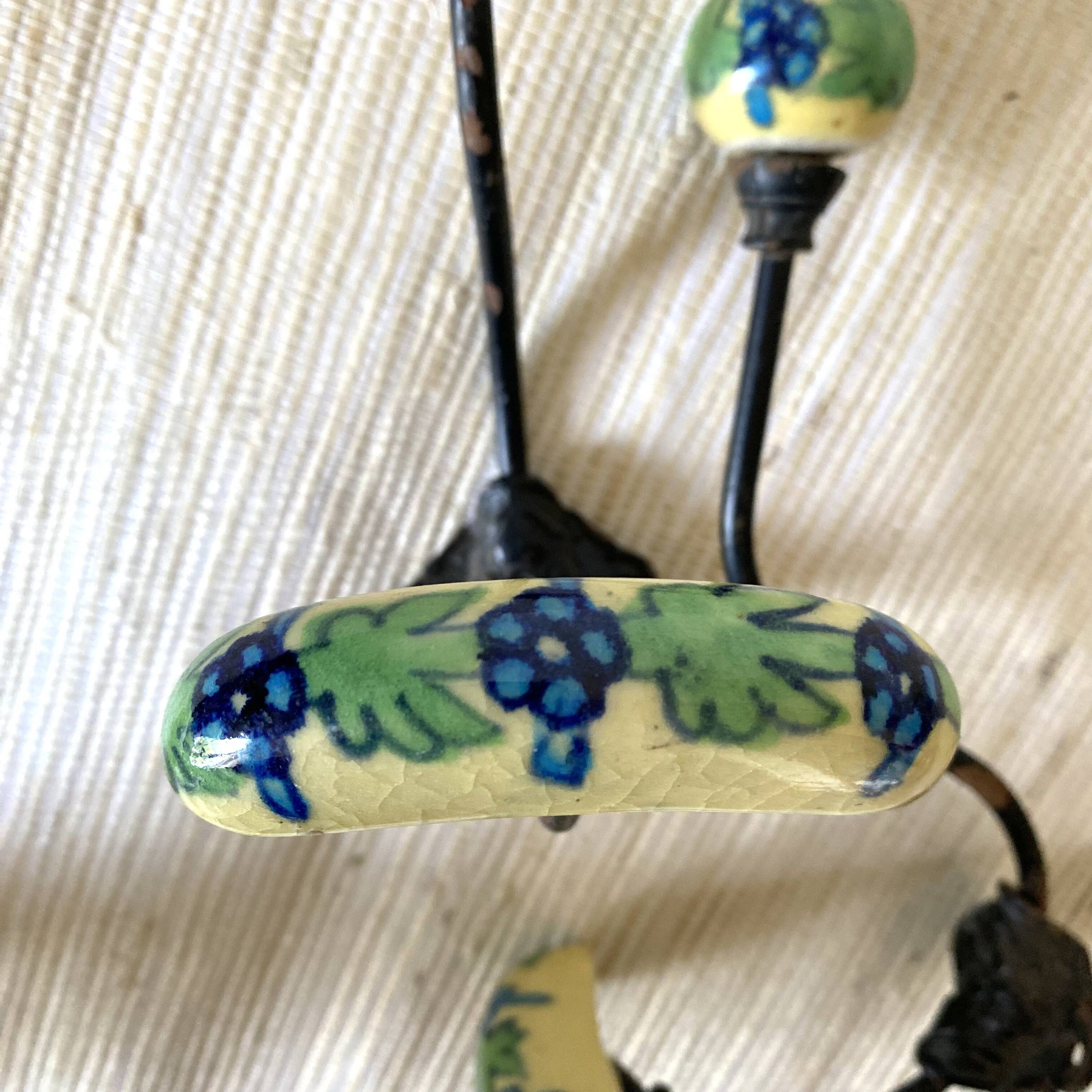 Metal and flowered ceramic coat hooks