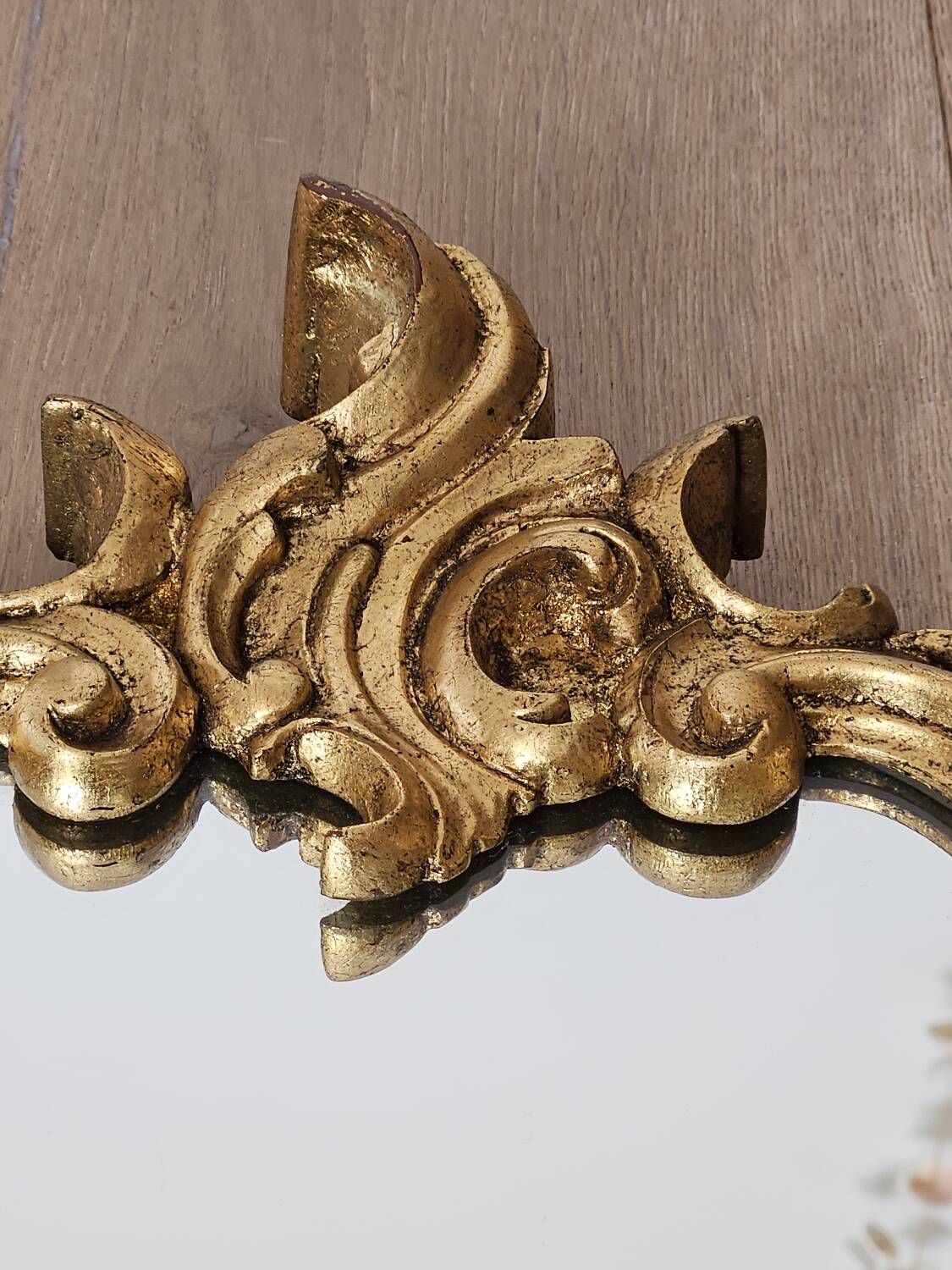 Rockery mirror under gilded frame