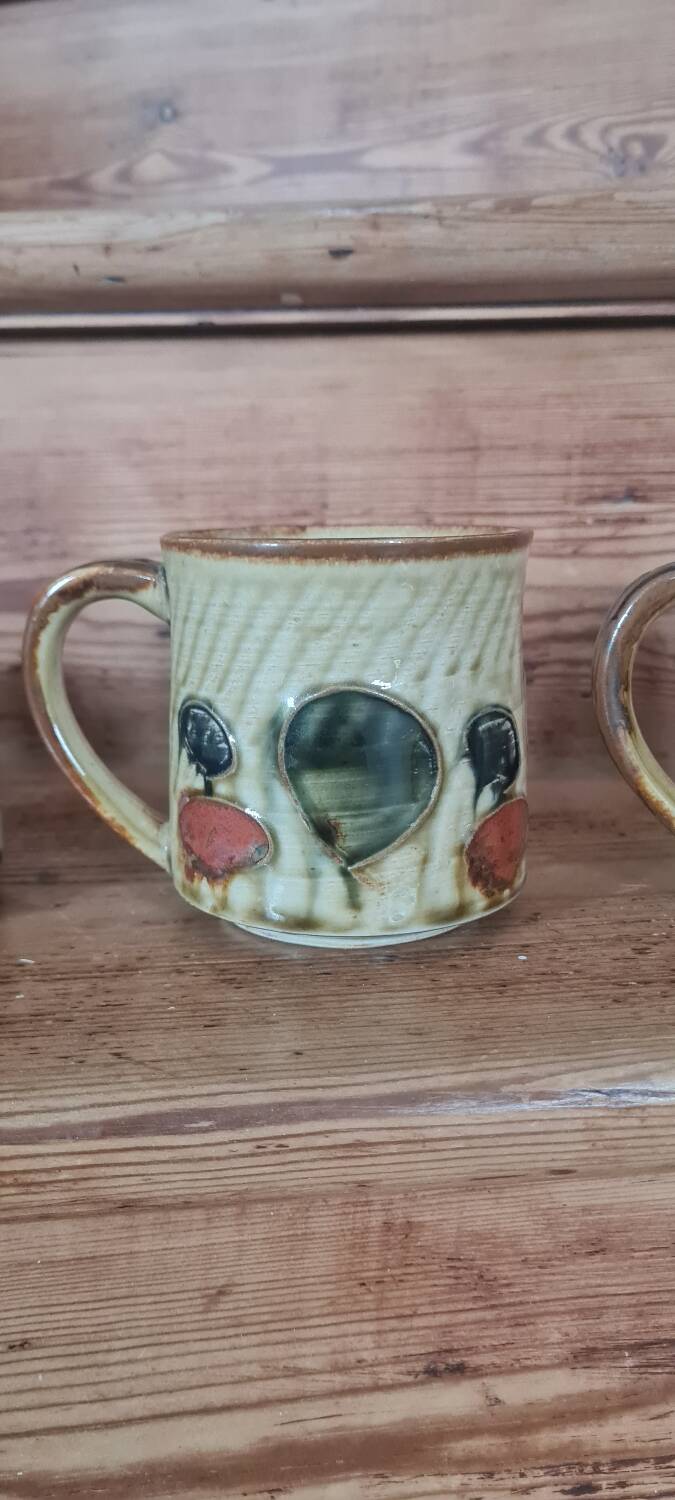 Glazed stoneware mugs from the 60s