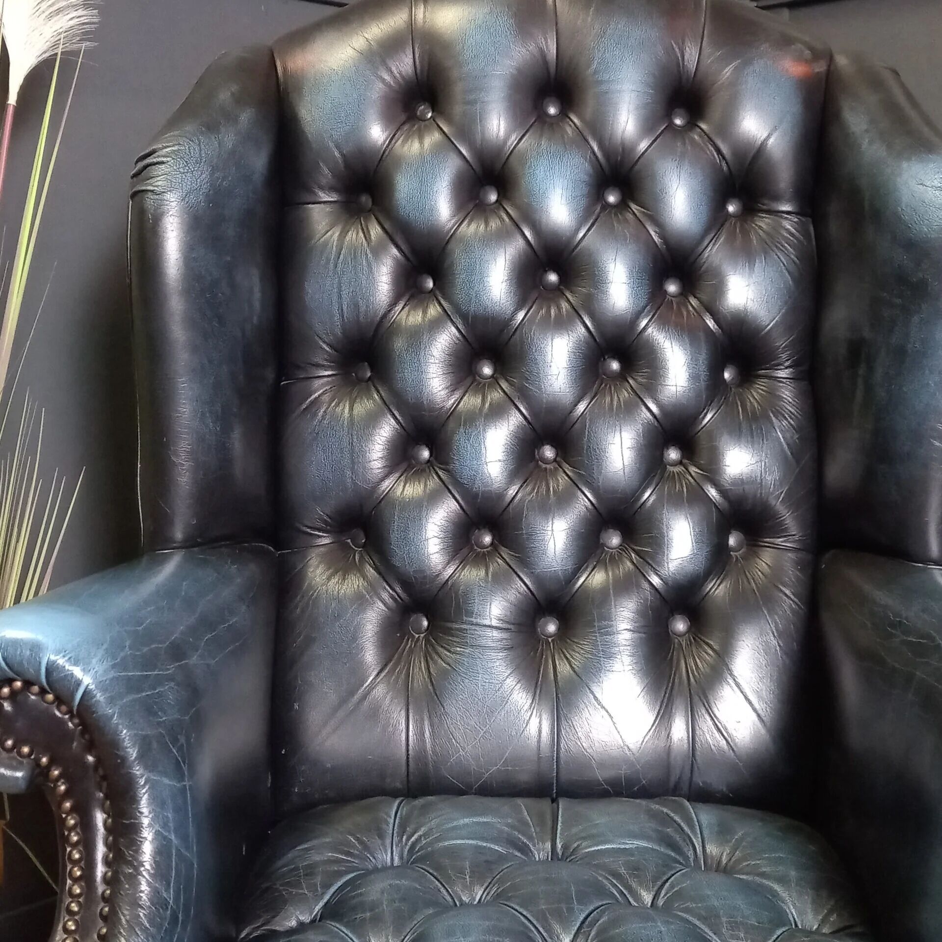 Blue chesterfield barrel back armchair