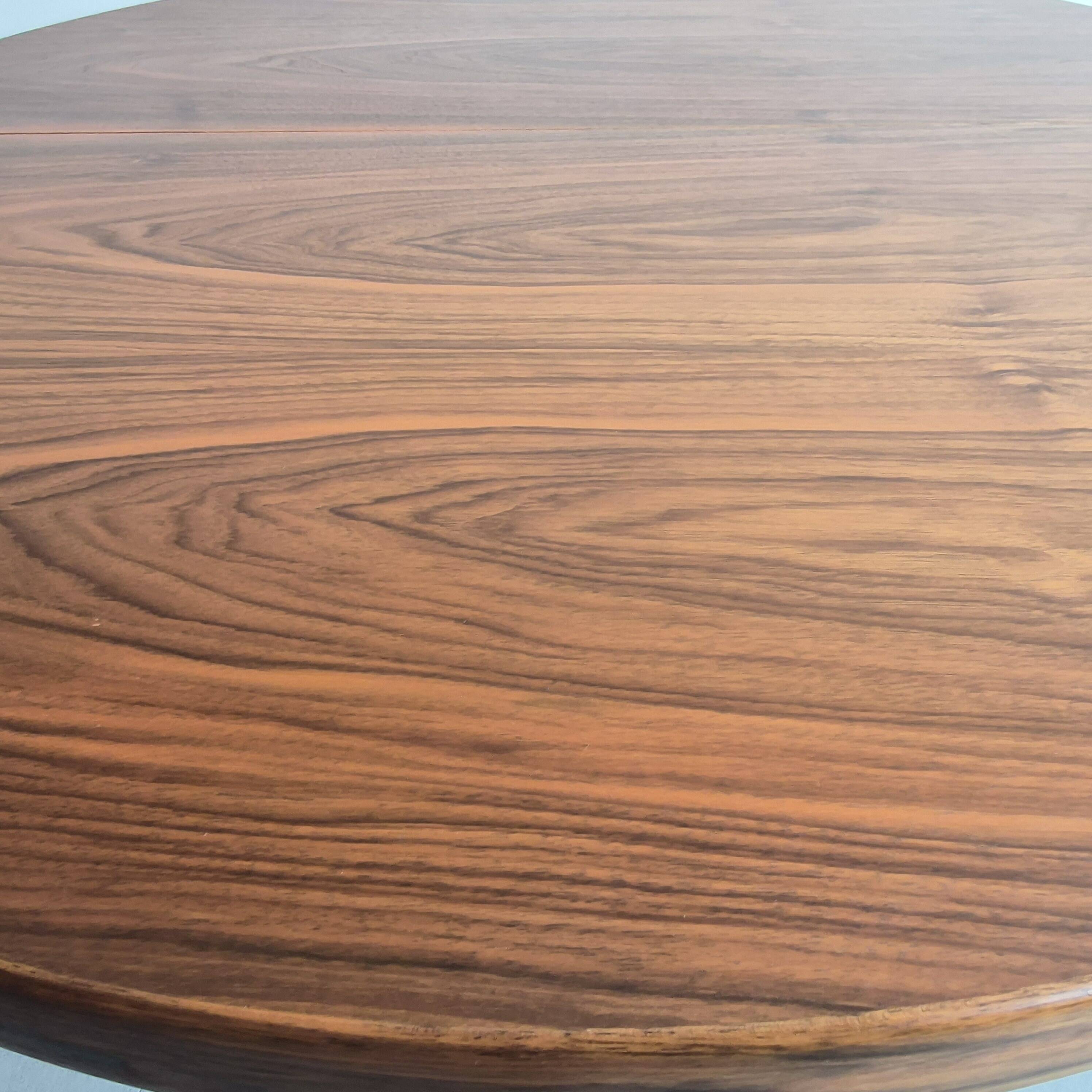 Baumann dining table 1960 extendable from 114 to 167 cm with integrated extensions.