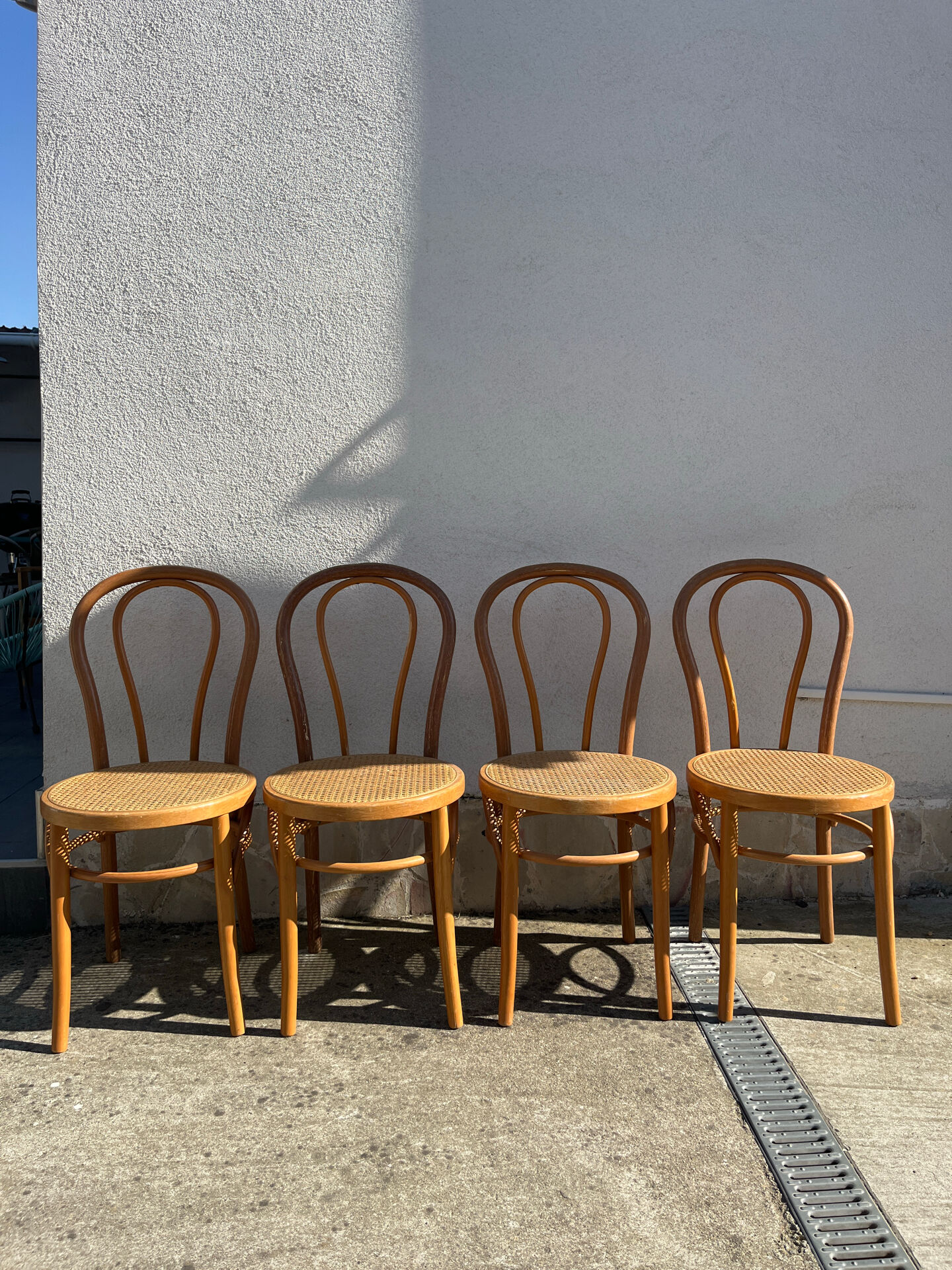 Set of 4 bentwood bistro chairs with caning.