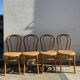 Set of 4 bentwood bistro chairs with caning.