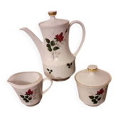 White porcelain coffee service of 3 pieces with a rose design.