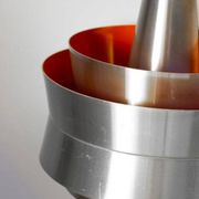 Carl Thore's Trava lamp in aluminium with an orange lacquered interior.