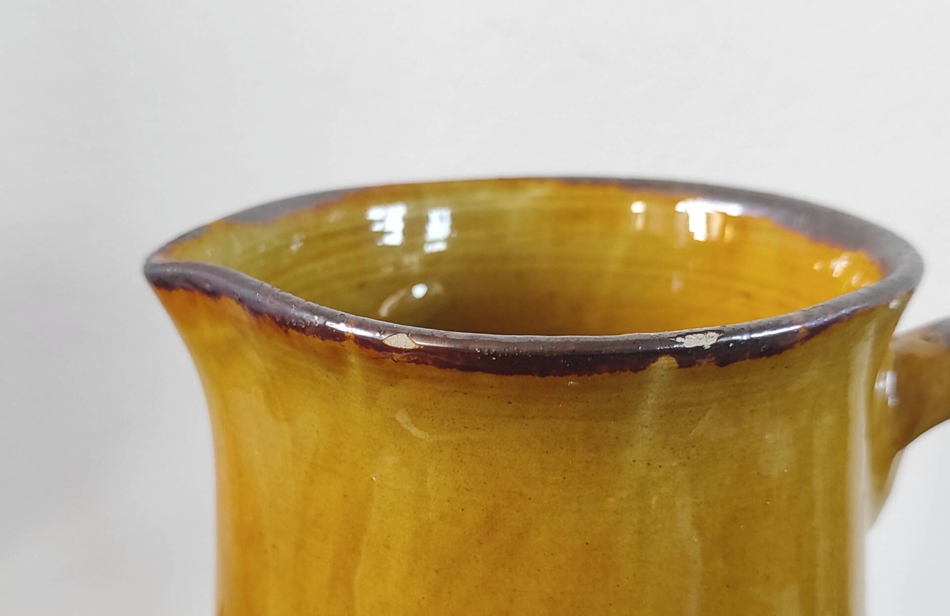 Vintage glazed terracotta pitcher