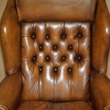 Captain's chair Chesterfield vintage leather with tufted wingback.