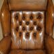 Captain's chair Chesterfield vintage leather with tufted wingback.