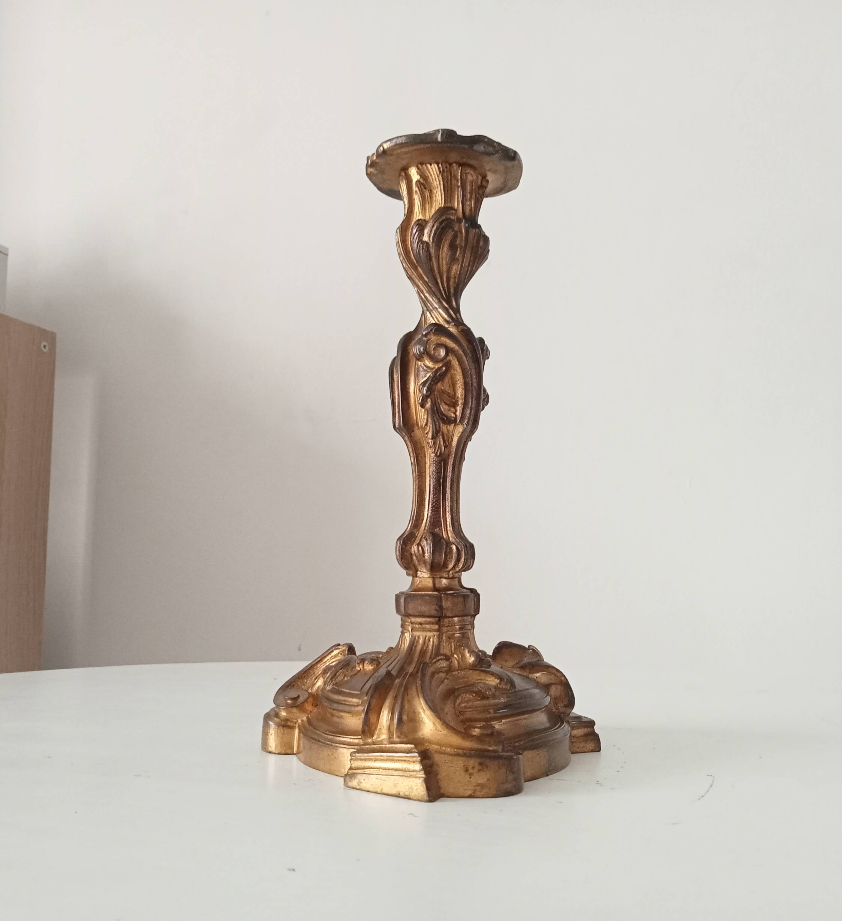 Antique 19th-century solid gilded bronze candlestick in the Louis XV style.