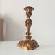 Antique 19th-century solid gilded bronze candlestick in the Louis XV style.