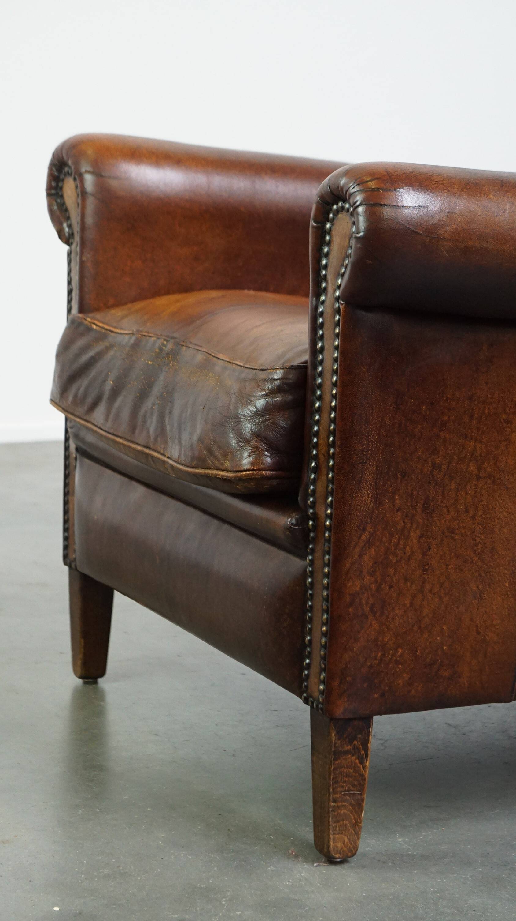 Vintage sheepskin armchair with beautiful warm colors and excellent seating comfort