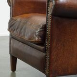 Vintage sheepskin armchair with beautiful warm colors and excellent seating comfort