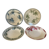 Four old earthenware plates