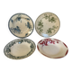Four old earthenware plates