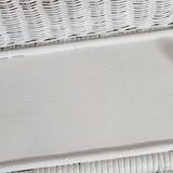 White woven wicker shelf