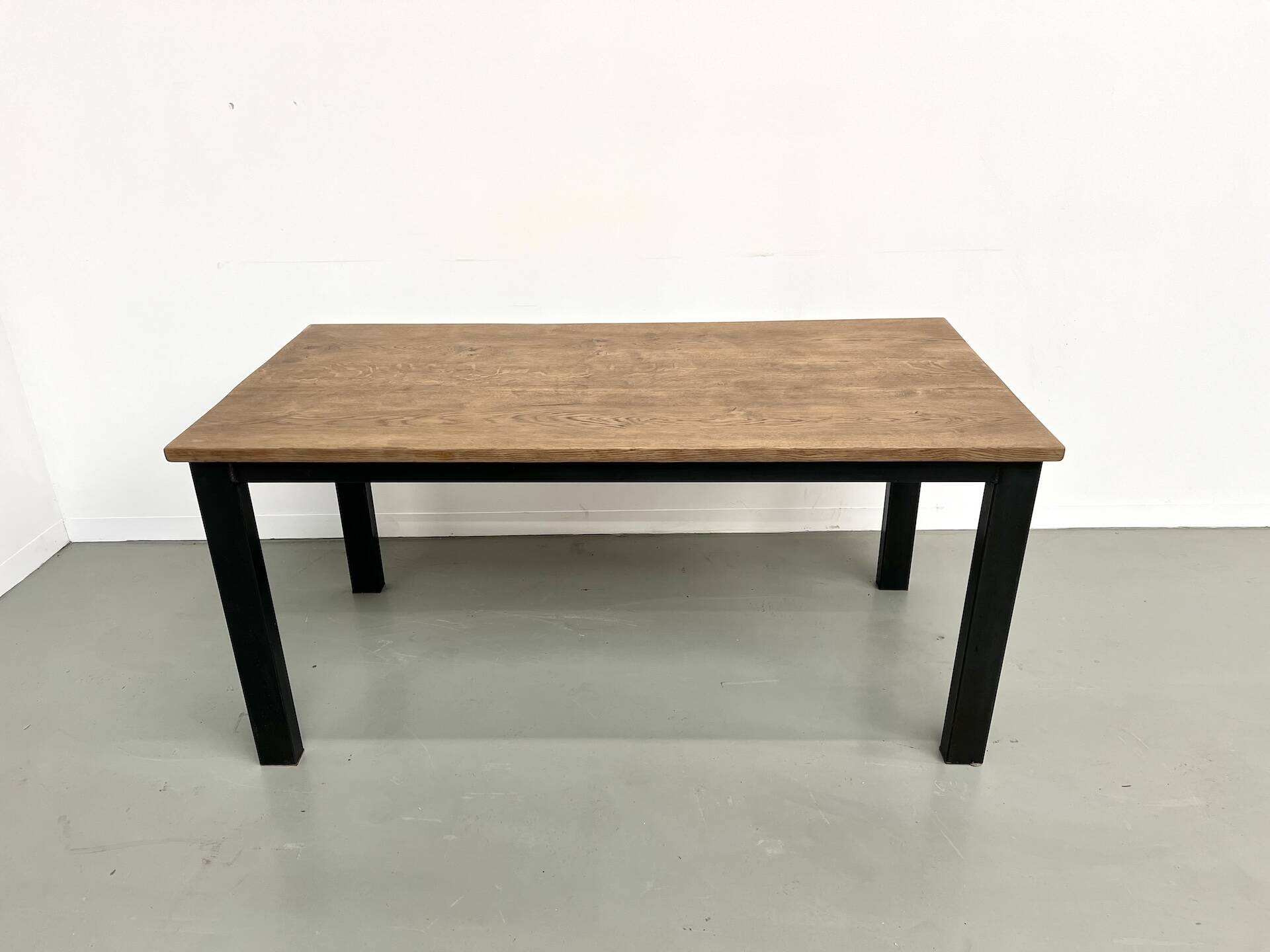 Solid oak dining table from the 70s with metal legs
