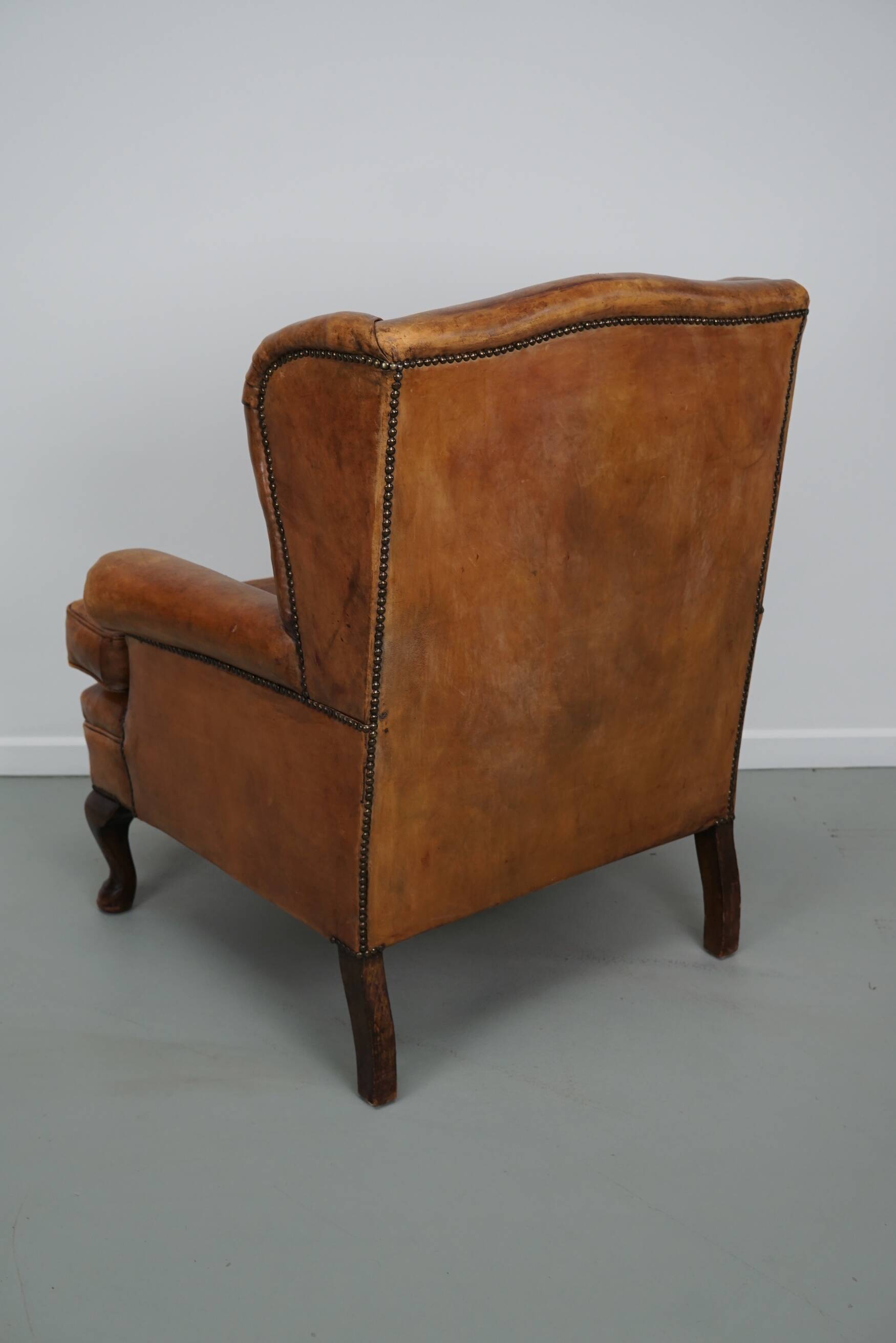 Vintage Dutch cognac coloured leather club chair, with footstool