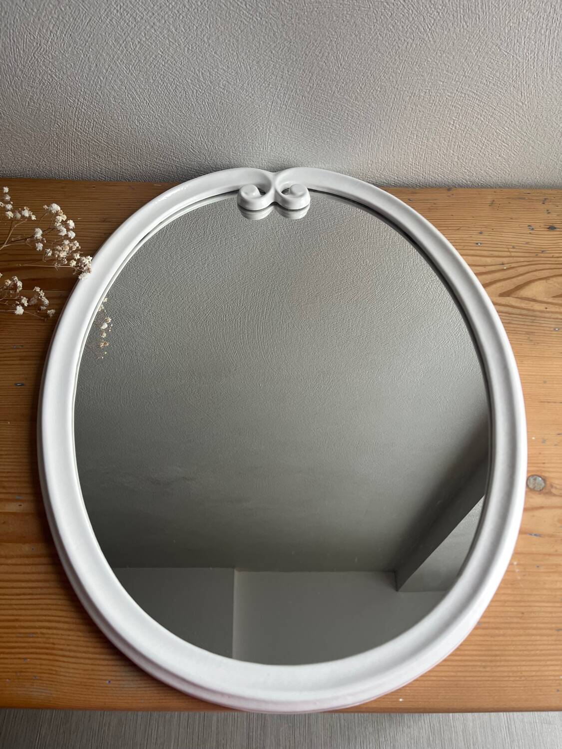 Vintage oval mirror in white enamelled cast iron