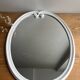 Vintage oval mirror in white enamelled cast iron