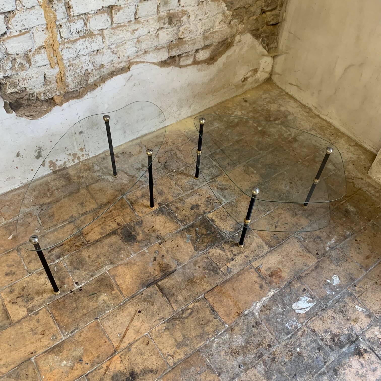 Pair of two 1950s glass and metal coffee tables, in the style of Edoardo Paoli