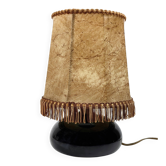Sculptural table lamp in deep black ceramic.