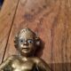Rare bronze child statuette with blue eyes