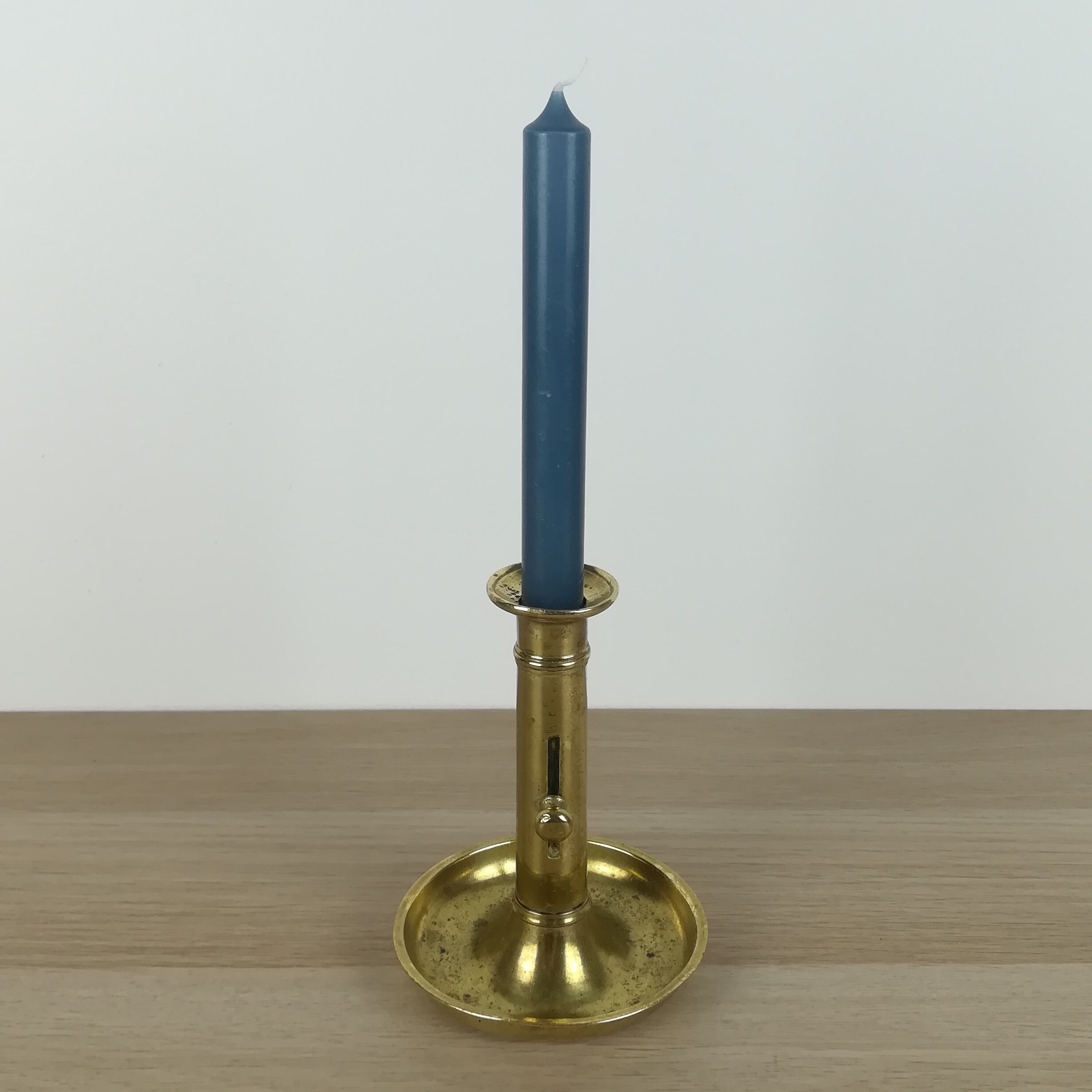 Brass pusher candle holder