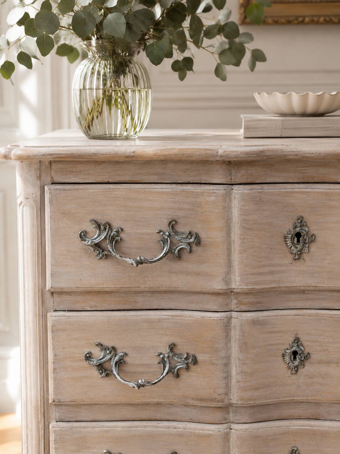 Beautifully crafted Louis XVI style commode in bleached wood.