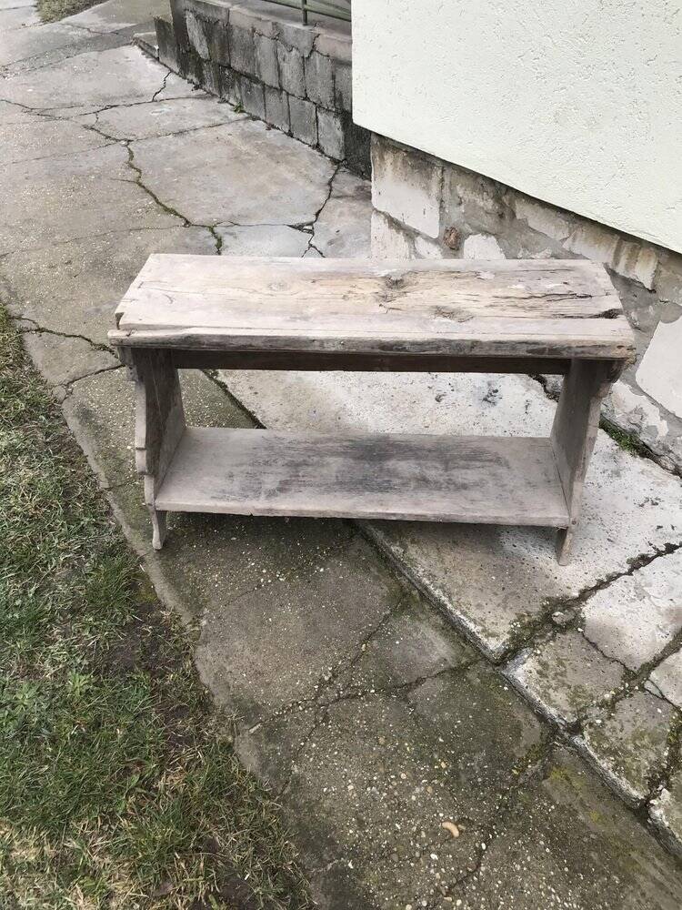 Small country bench in grey pine, rustic antique style with storage shelf.
