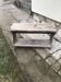 Small country bench in grey pine, rustic antique style with storage shelf.