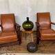 PAIR OF BRUTALIST ARMCHAIRS IN TEAK AND VINTAGE COGNAC LEATHER FROM THE 1950S