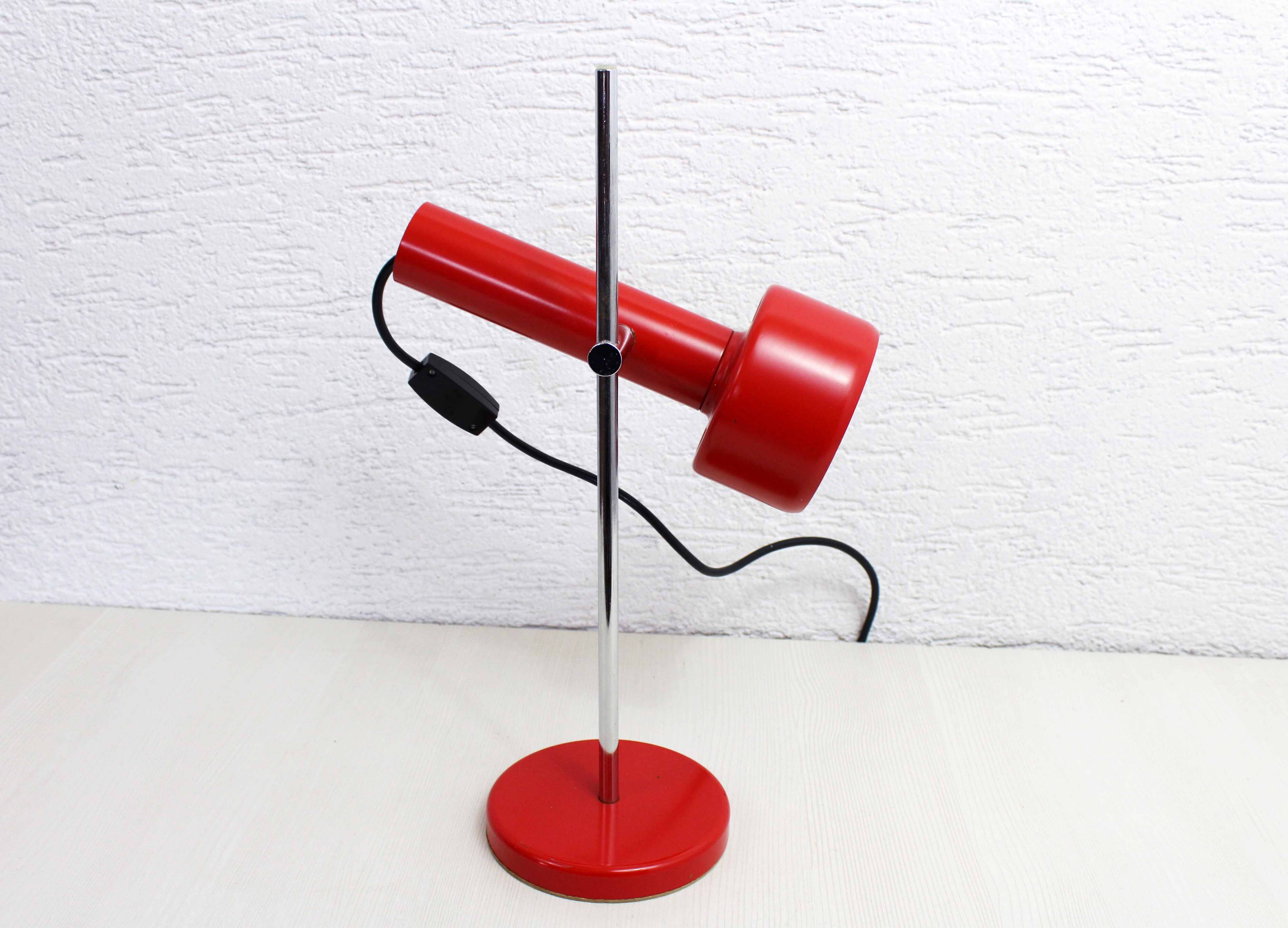 Red metal articulated desk lamp