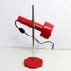 Red metal articulated desk lamp