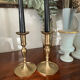 Pair of brushed brass candle holders