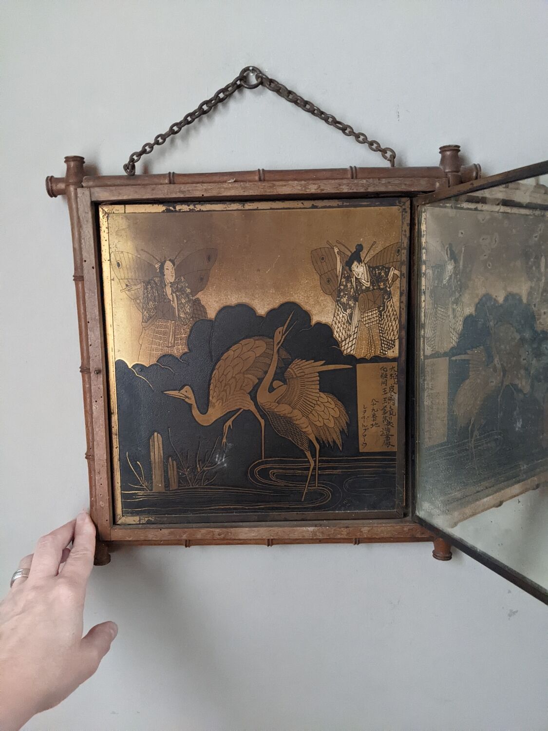 Antique Asian decorative triptych mirror with chain wall decoration in wood.