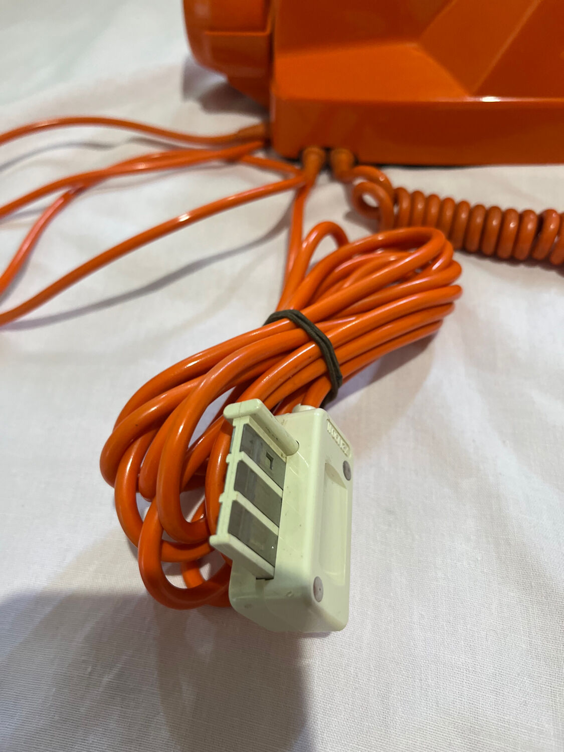 Orange vintage phone with socotel dial