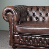 Chesterfield sofa in cowhide, 4 seats