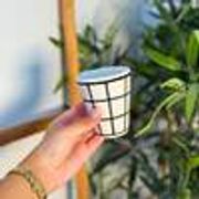 Tisslit glass, handcrafted with a black and white checkered pattern.