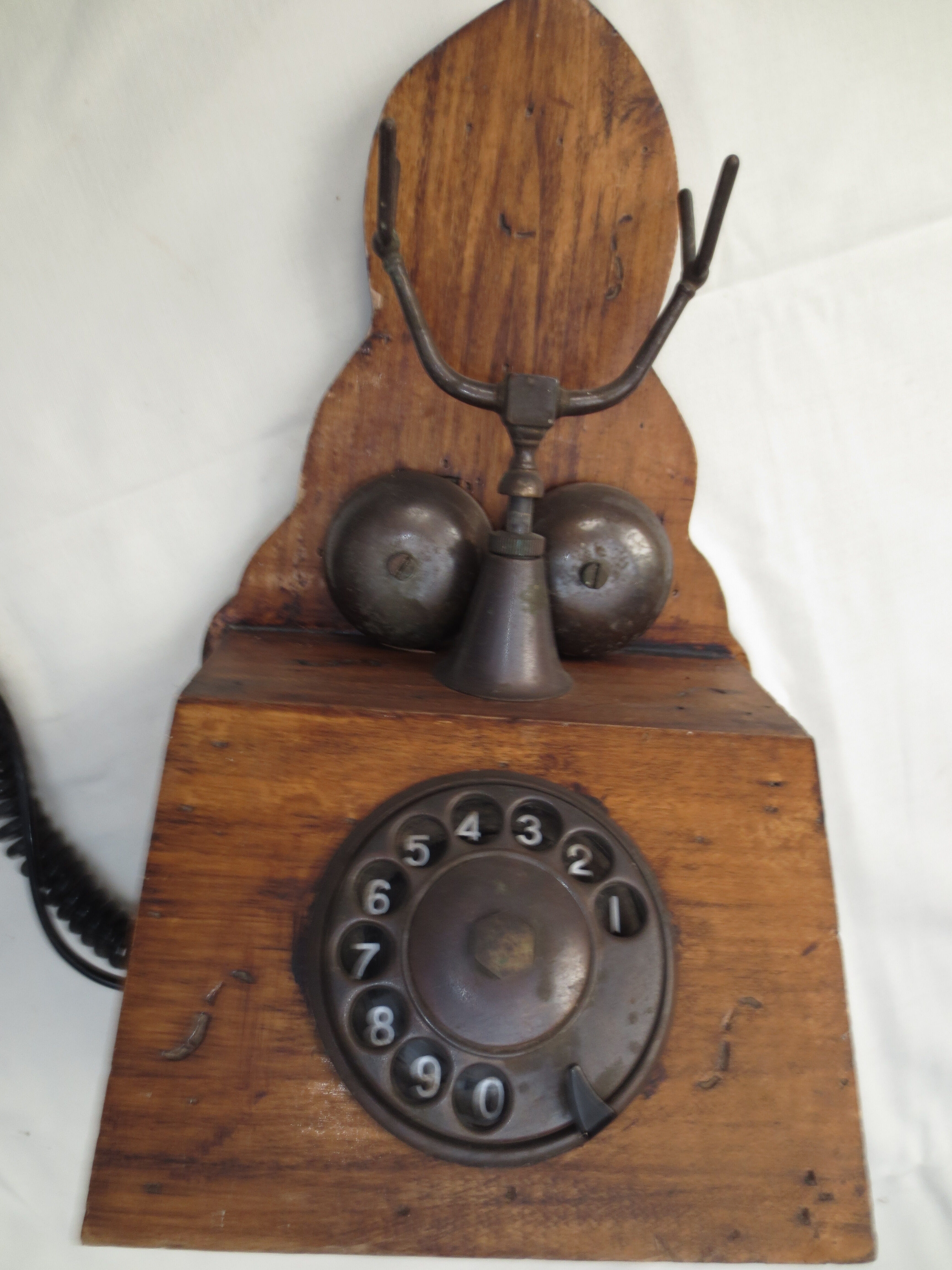 Old wood and metal wall phone