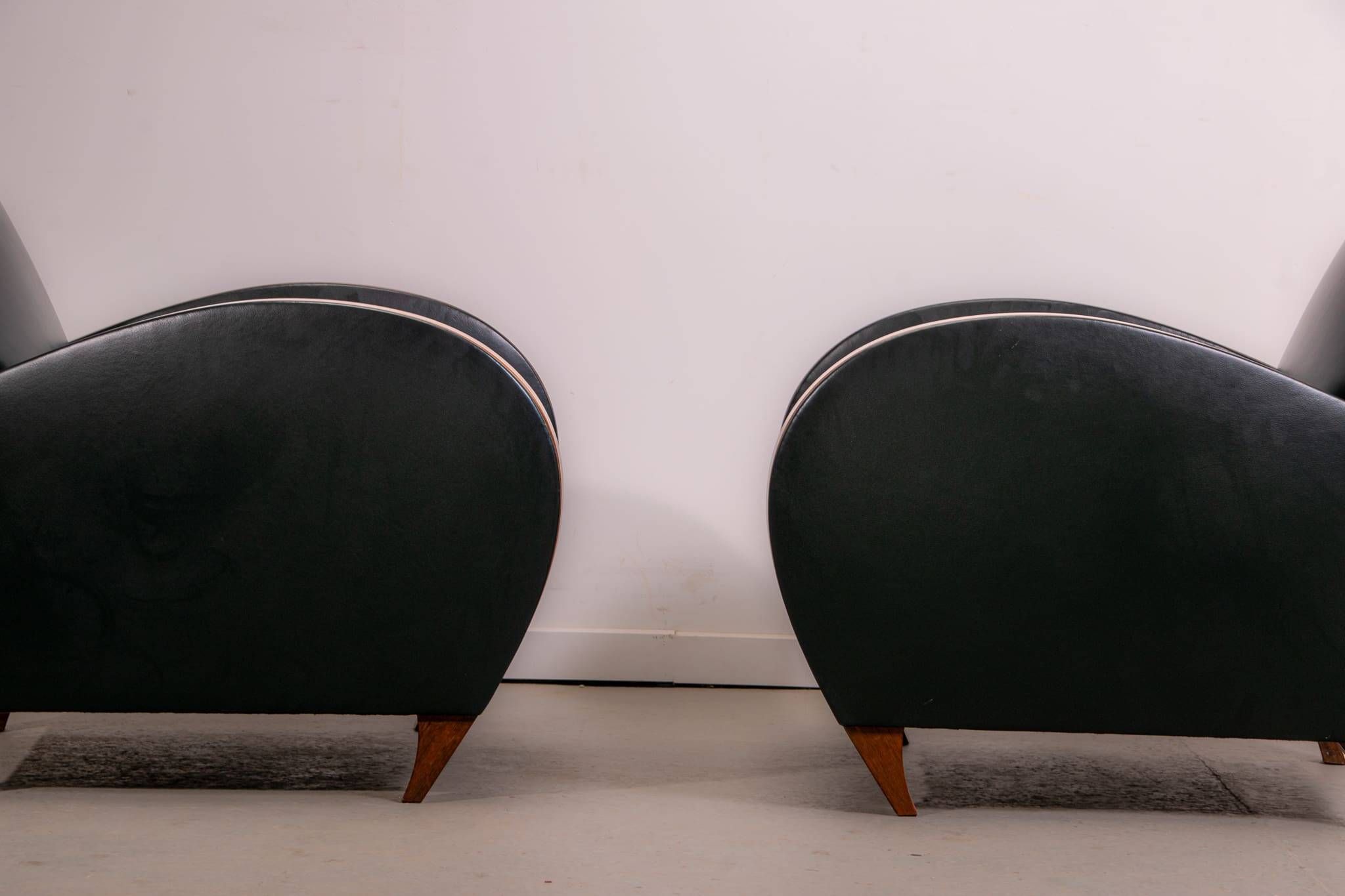 Pair of mid-century leather armchairs, circa 1970, made in Belgium.
