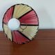Pleated red and pale yellow plastic conical lampshade from the 1960s.