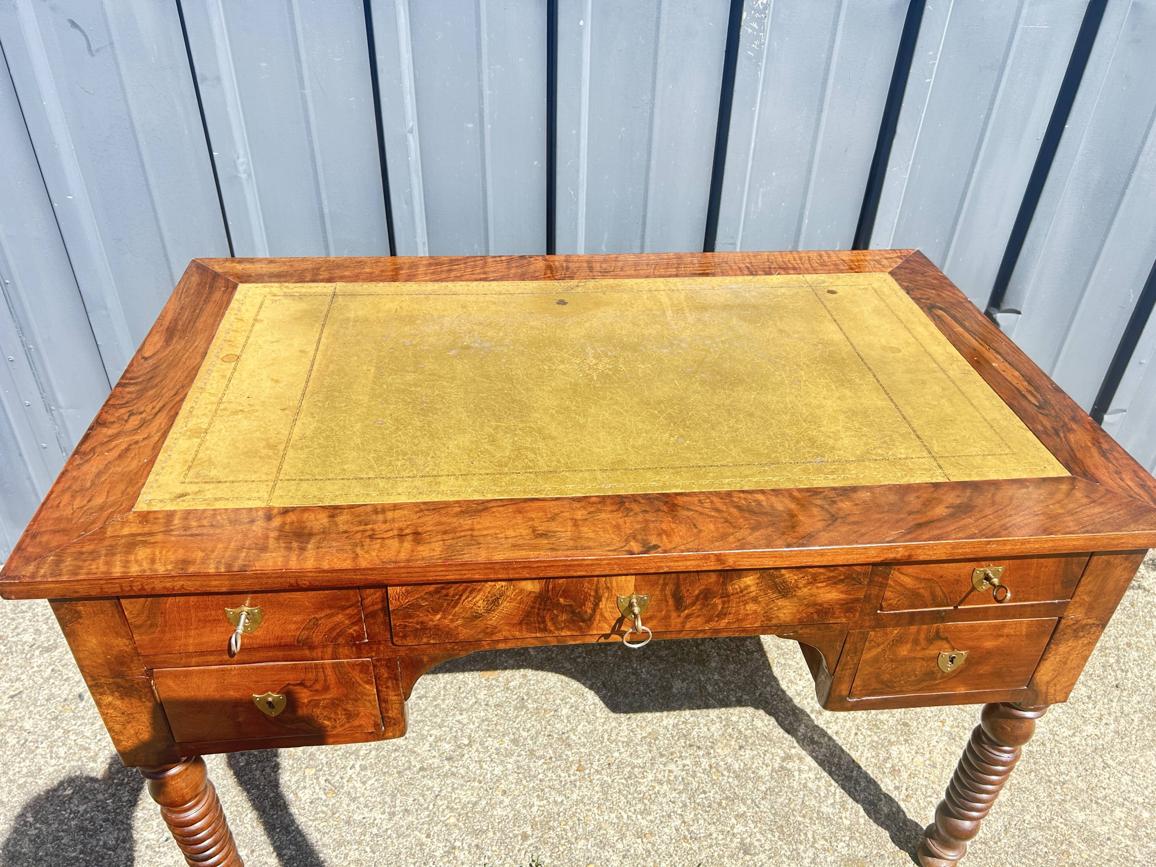 Louis Philippe desk in walnut, with a leather top.