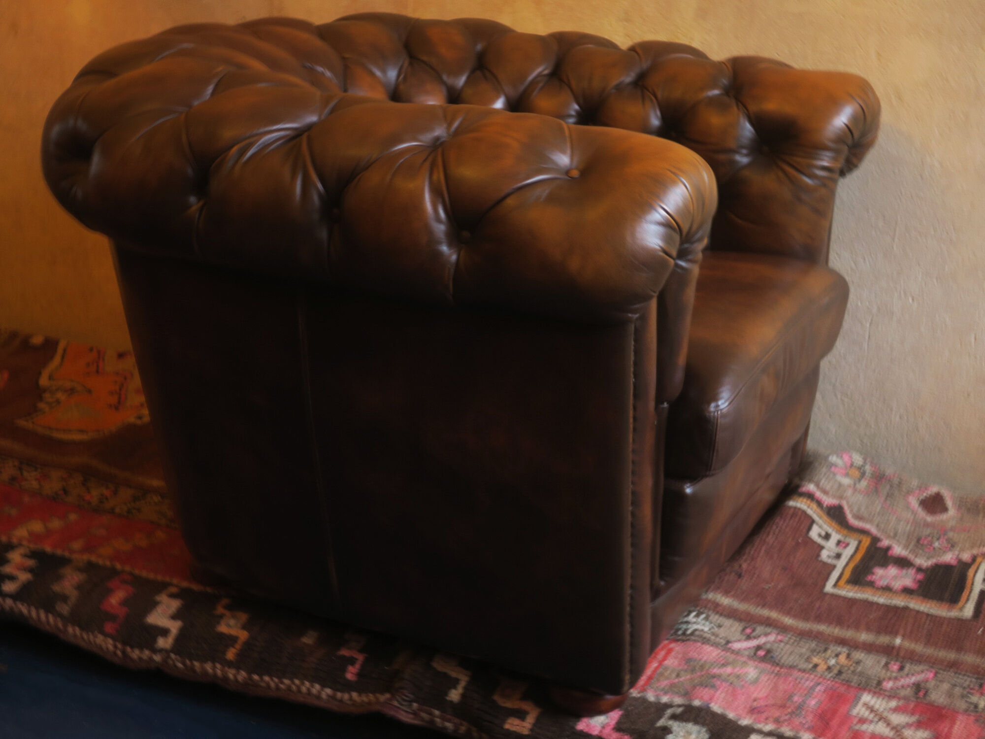 Chesterfield club armchair in patinated chestnut coloured leather