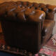 Chesterfield club armchair in patinated chestnut coloured leather