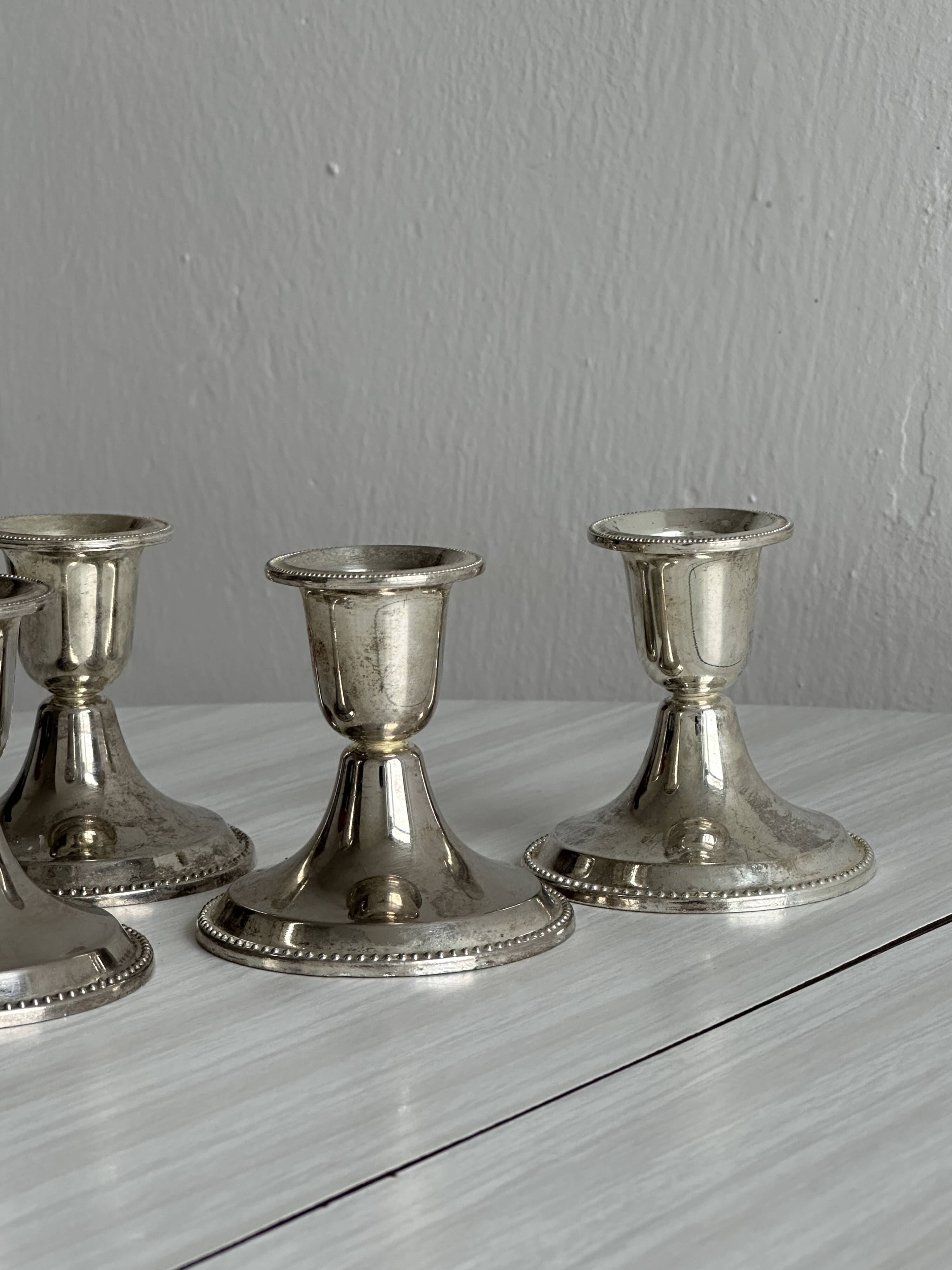 4 vintage metal candle holders