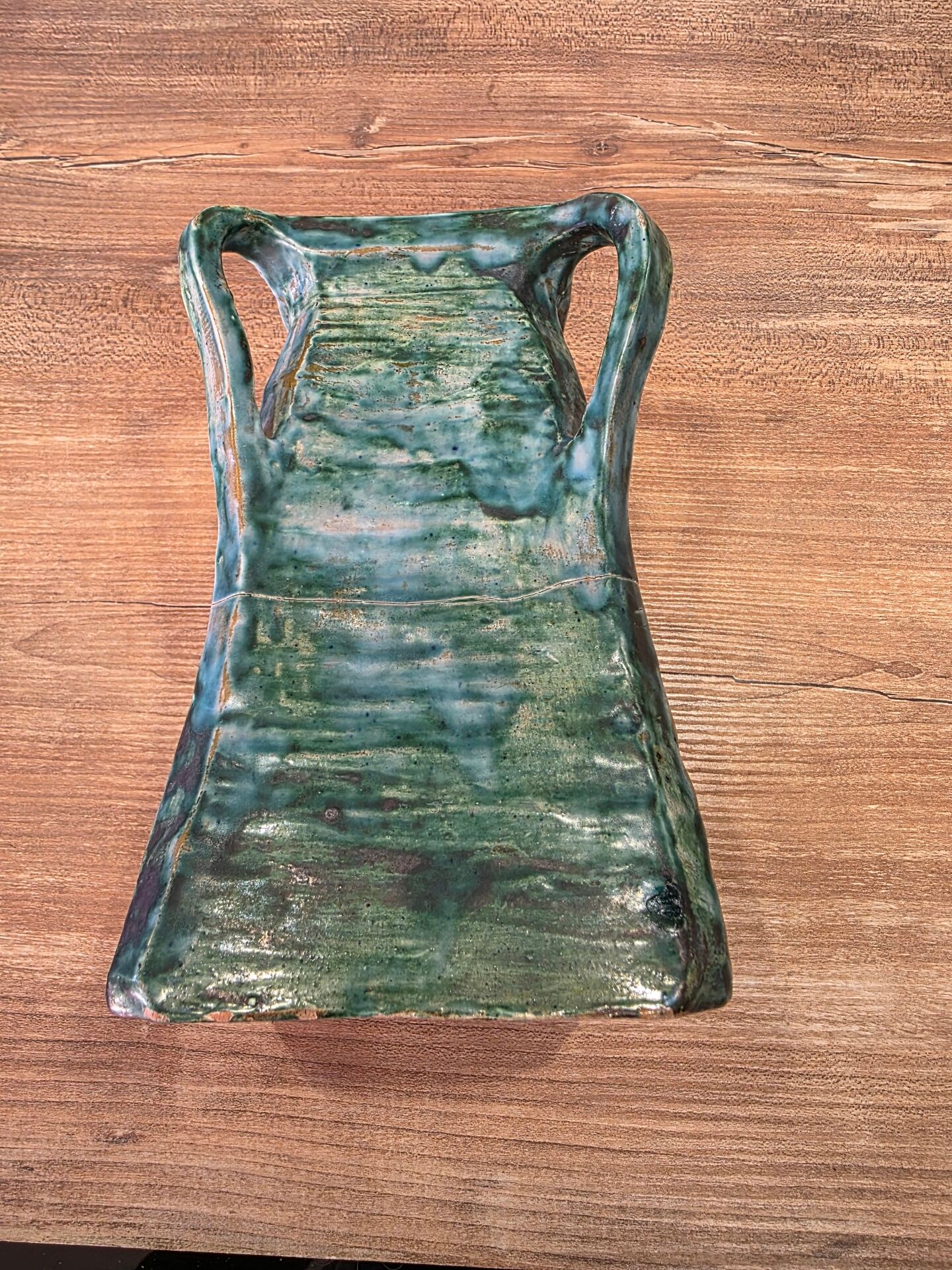 Vintage brutalist ceramic vase with 4 green handles.