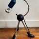Articulated tripod foot lamp inspired by the Memphis movement